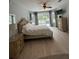 Serene main bedroom with private access to the outdoor pool at 633 Grand Cypress Pt, Sanford, FL 32771