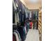 Large walk-in closet with built-in shelving and rods for maximum storage at 633 Grand Cypress Pt, Sanford, FL 32771