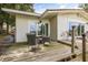 A spacious back patio features outdoor seating and sliding glass doors to the interior at 6665 Lake Cane Dr, Orlando, FL 32819