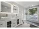 Bright bathroom featuring a double vanity, modern fixtures, and a glass-enclosed shower at 6665 Lake Cane Dr, Orlando, FL 32819