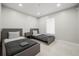 Bedroom with two twin beds, neutral decor, and a bright window at 6665 Lake Cane Dr, Orlando, FL 32819