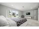 Bright bedroom featuring a water view, tile floors, and a comfortable bed at 6665 Lake Cane Dr, Orlando, FL 32819