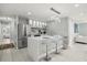 Modern kitchen with stainless steel appliances, breakfast bar, and sleek cabinetry at 6665 Lake Cane Dr, Orlando, FL 32819