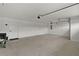 Spacious three-car garage with two doors and plenty of room for storage at 6991 Sugar Creek Path, The Villages, FL 34762