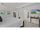 Well-lit bedroom featuring a king bed, ceiling fan, and views to other rooms at 6991 Sugar Creek Path, The Villages, FL 34762