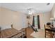 Bedroom features hardwood floors, a ceiling fan, a tv, and a window with a curtain at 815 Forestwood Dr, Minneola, FL 34715