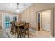 Cozy dining area with view to the pool through a sliding glass door at 815 Forestwood Dr, Minneola, FL 34715
