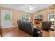 Cozy living room showcasing hardwood floors, fireplace, and a bright stained-glass front door at 815 Forestwood Dr, Minneola, FL 34715