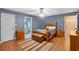 Comfortable main bedroom showcasing a decorative bed frame and ensuite bathroom at 815 Forestwood Dr, Minneola, FL 34715