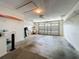 Spacious garage with sink, storage shelves and garage door, with lots of space at 8195 Se 174Th Rowland St, The Villages, FL 32162