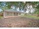 The backyard has a patio and plenty of space at 832 Willow Run St, Minneola, FL 34715