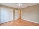 Bedroom with a closet and hardwood floors at 832 Willow Run St, Minneola, FL 34715