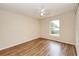 This bedroom has wood flooring and a ceiling fan at 832 Willow Run St, Minneola, FL 34715