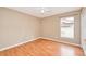 Bedroom with hardwood floors and a window at 832 Willow Run St, Minneola, FL 34715