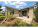Outdoor back patio area featuring a grill and landscaped yard at 8537 Se 177Th Bartram Loop, The Villages, FL 32162