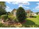 Charming backyard with lush landscaping enhances the property's appeal at 8537 Se 177Th Bartram Loop, The Villages, FL 32162