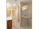 Bathroom with a new vanity, large mirror, glass shower, and a sun tunnel at 8537 Se 177Th Bartram Loop, The Villages, FL 32162