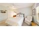 Cozy bedroom featuring a comfortable bed, soft lighting, and a relaxing armchair at 8537 Se 177Th Bartram Loop, The Villages, FL 32162