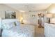 This bedroom features a ceiling fan, closet, and a wall with a picturesque painting at 8537 Se 177Th Bartram Loop, The Villages, FL 32162