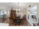 Dining room with hardwood floors, chandelier, and a decorative hutch at 8537 Se 177Th Bartram Loop, The Villages, FL 32162