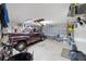 Spacious garage with classic car, ample storage, and room for parking and hobbies at 8537 Se 177Th Bartram Loop, The Villages, FL 32162