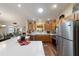 Bright kitchen with a breakfast bar looking out to the dining area at 8537 Se 177Th Bartram Loop, The Villages, FL 32162