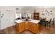 Open concept home with kitchen breakfast bar leading to dining and living areas at 8537 Se 177Th Bartram Loop, The Villages, FL 32162