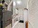 Functional laundry room featuring modern appliances, storage cabinets, and a clean, organized space at 8537 Se 177Th Bartram Loop, The Villages, FL 32162