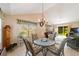 Living room with dining area featuring a view of the back yard at 8537 Se 177Th Bartram Loop, The Villages, FL 32162