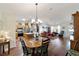 Open floor plan with the kitchen and dining room leading to the bright living room at 8537 Se 177Th Bartram Loop, The Villages, FL 32162