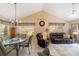 Bright living room with dining area, vaulted ceiling, and comfortable seating arrangement at 8537 Se 177Th Bartram Loop, The Villages, FL 32162