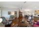 Comfortable living room with hardwood floors, desk, and decor throughout at 8537 Se 177Th Bartram Loop, The Villages, FL 32162