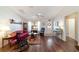 Bright living room with hardwood floors, ceiling fan and a front door at 8537 Se 177Th Bartram Loop, The Villages, FL 32162
