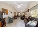 Spacious open-concept living room featuring vaulted ceilings, tile floors, and comfortable seating at 8537 Se 177Th Bartram Loop, The Villages, FL 32162