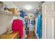 Organized walk-in closet with shelving, clothing racks, and ample storage space at 8537 Se 177Th Bartram Loop, The Villages, FL 32162