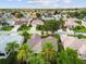 A high aerial view of the community, showing lush landscaping and well-maintained homes in a desirable location at 891 Lucky Ln, The Villages, FL 32162