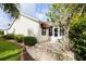 Charming backyard with well-maintained landscaping, a patio, and ample space for outdoor enjoyment at 891 Lucky Ln, The Villages, FL 32162