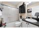 Well-maintained bathroom featuring a shower over the tub with a sleek sliding door and updated fixtures at 891 Lucky Ln, The Villages, FL 32162