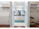 En-suite bathroom with double sinks, dual walk-in closets and modern fixtures at 891 Lucky Ln, The Villages, FL 32162