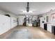 Well-organized garage with ample storage cabinets and space for vehicles and projects at 891 Lucky Ln, The Villages, FL 32162