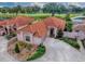 Beautiful aerial view of a neighborhood with terracotta roofs, landscaped yards, and scenic golf course views at 903 Santa Anna Ln, Lady Lake, FL 32159
