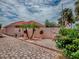 Private backyard patio featuring lush greenery, potted plants, and lovely pavers; a tranquil outdoor oasis at 903 Santa Anna Ln, Lady Lake, FL 32159