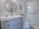 Modern bathroom with vanity, updated sink and toilet, modern fixtures and a glass enclosed shower at 903 Santa Anna Ln, Lady Lake, FL 32159