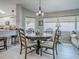 Dining room featuring a round table, wood chairs, and large windows with plenty of light at 903 Santa Anna Ln, Lady Lake, FL 32159
