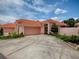 Charming one-story home featuring a red tile roof, spacious driveway, and well-maintained landscaping at 903 Santa Anna Ln, Lady Lake, FL 32159