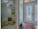 Welcoming foyer featuring a decorative glass front door, stylish rug, and a glimpse into the living room at 903 Santa Anna Ln, Lady Lake, FL 32159