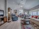 Expansive living room with wood floors, stylish furniture, and an open layout with seamless flow to other areas at 903 Santa Anna Ln, Lady Lake, FL 32159
