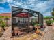 Outdoor screened-in patio featuring comfortable seating, stone pavers, and serene views at 903 Santa Anna Ln, Lady Lake, FL 32159