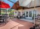 Spacious lanai with multiple seating areas and a lovely view; perfect for outdoor entertaining and relaxation at 903 Santa Anna Ln, Lady Lake, FL 32159