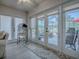 Bright sunroom featuring floor-to-ceiling windows and doors, offering a seamless transition to the outdoor patio at 903 Santa Anna Ln, Lady Lake, FL 32159